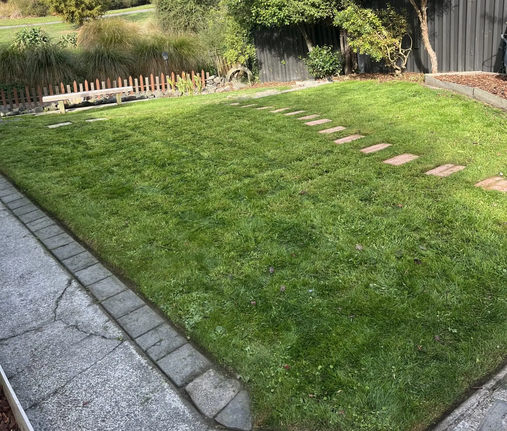 Freshly mown lawn and stepping stones after a Rapid Refresh tidy-up in Christchurch